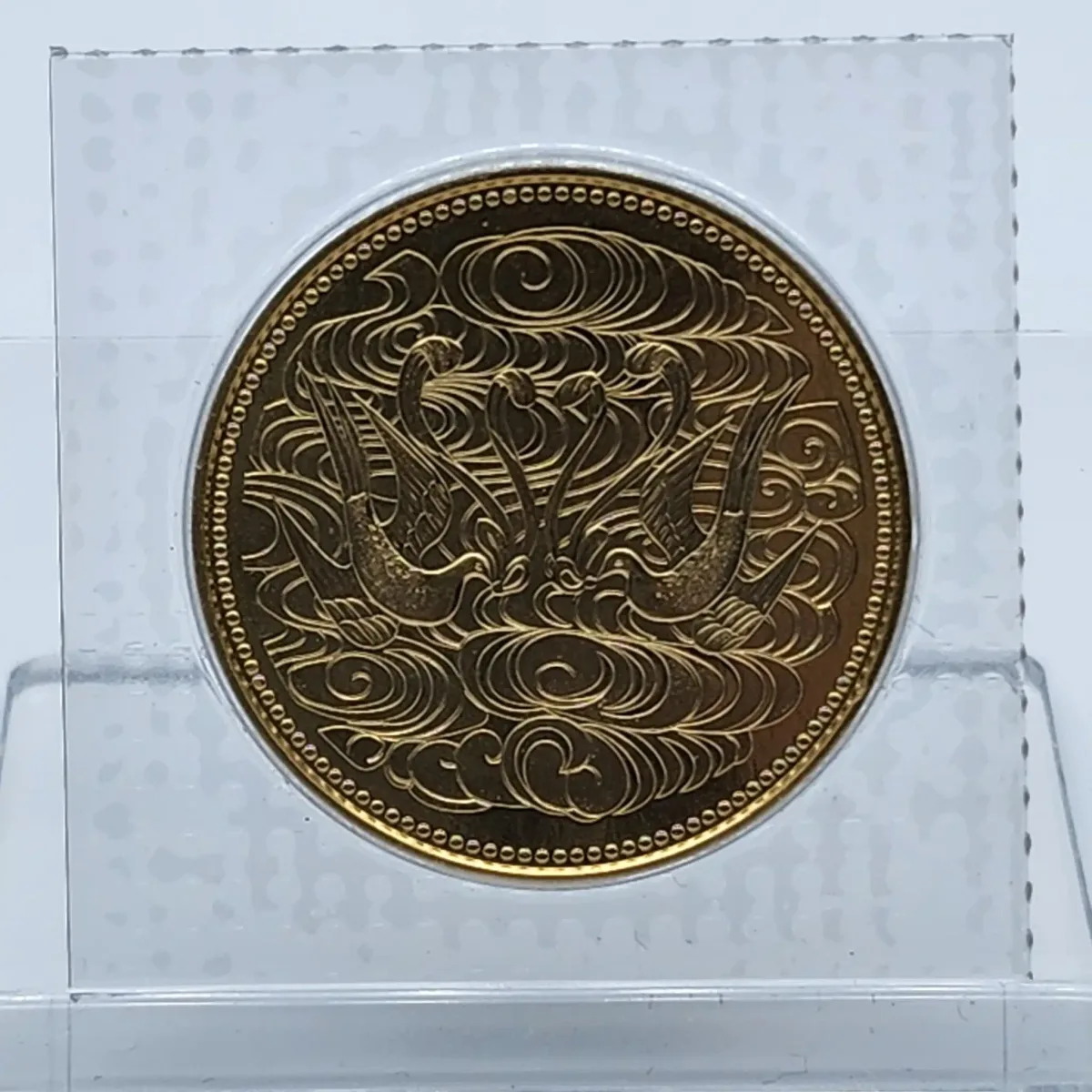 御在位60年記念10万円金貨